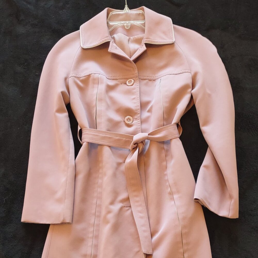 Lined water resistant pink trenchcoat.